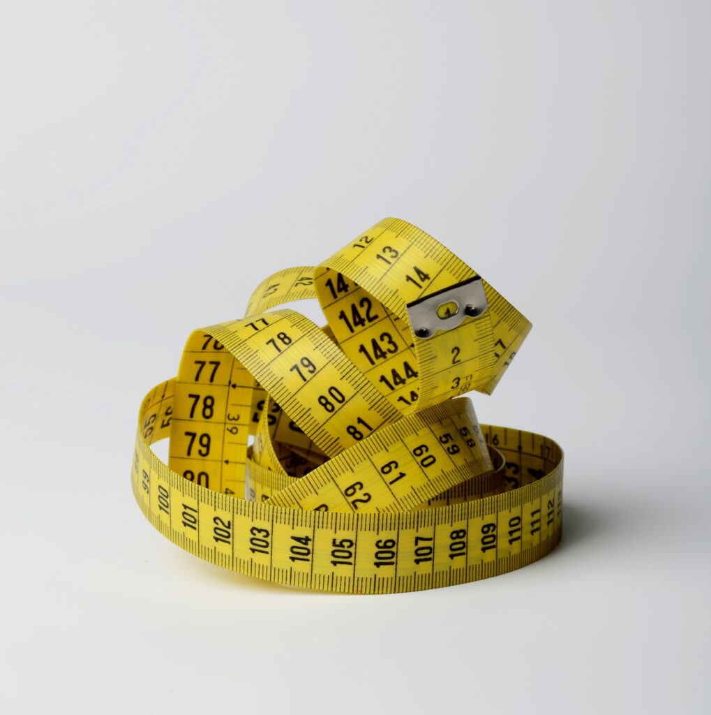 A sewing measuring tape in a pile. 