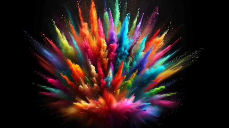 A vibrant rainbow eruption of colorful powder against a black background.