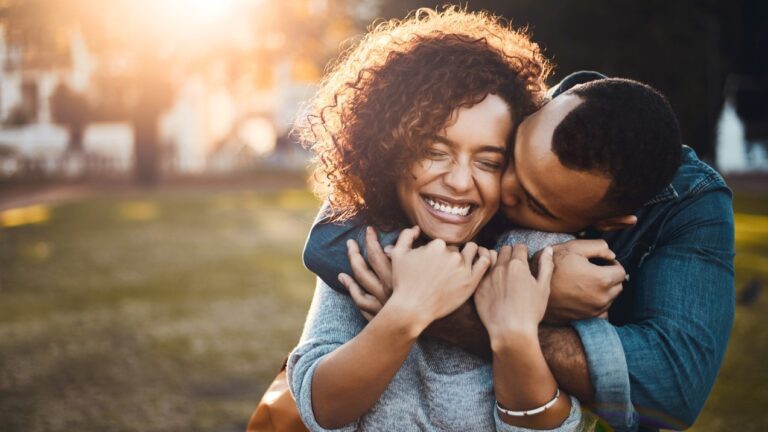 young couple of color hugging