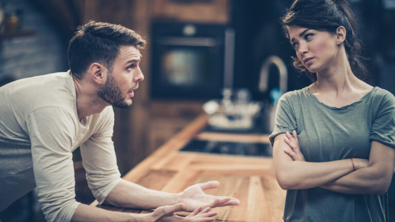 Young couple arguing while having problems in their relationship.