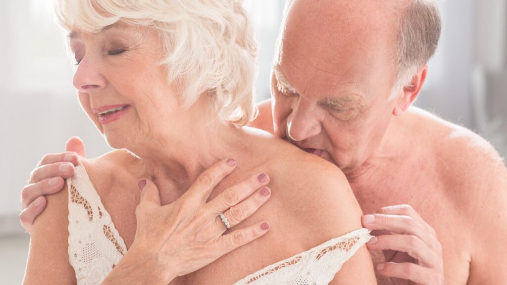 Slightly undressed senior couple getting intimate show sex after 60 is possible.