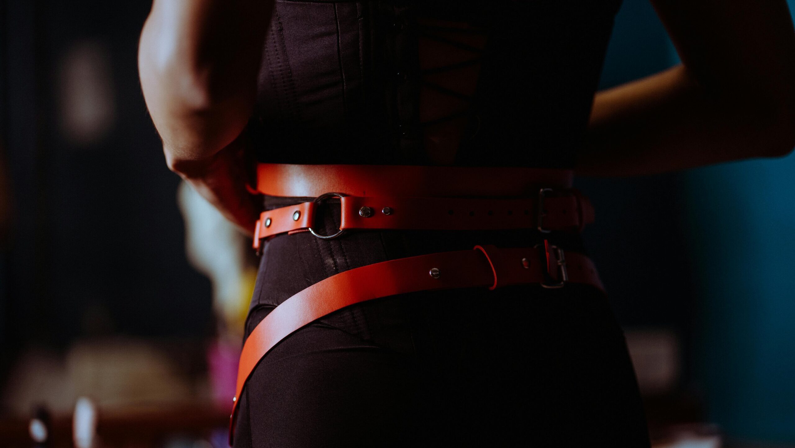 woman in pegging strap-on harness