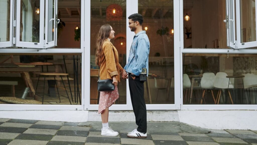 young couple outside of a coffee shop falling in love fast once again represent emophilia