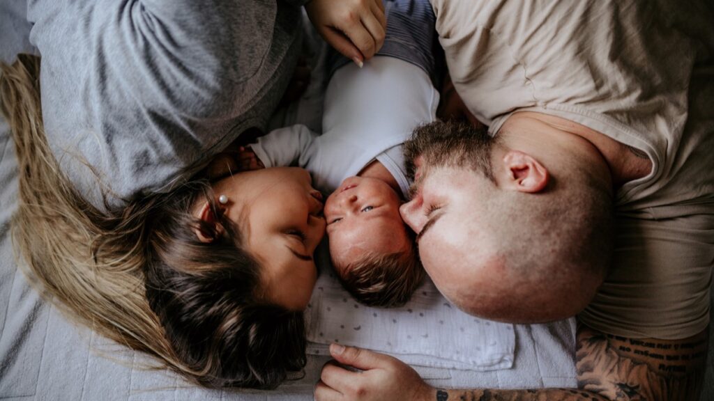 young white hetero family with newborn baby